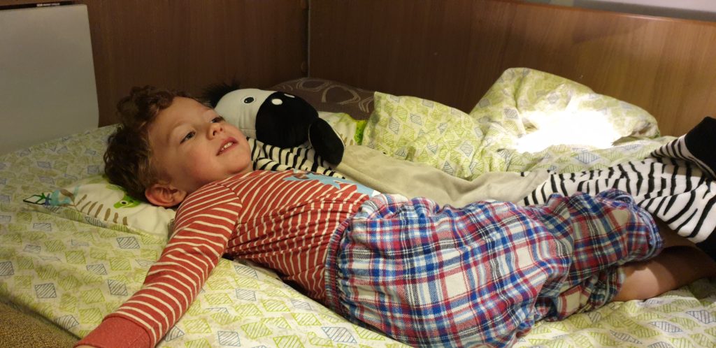 boy cosy in the caravan