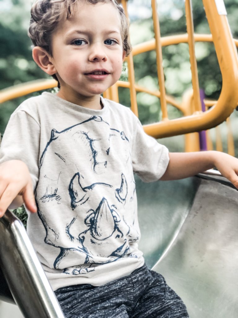 Boy at the play park at Abbey Wood Club Site