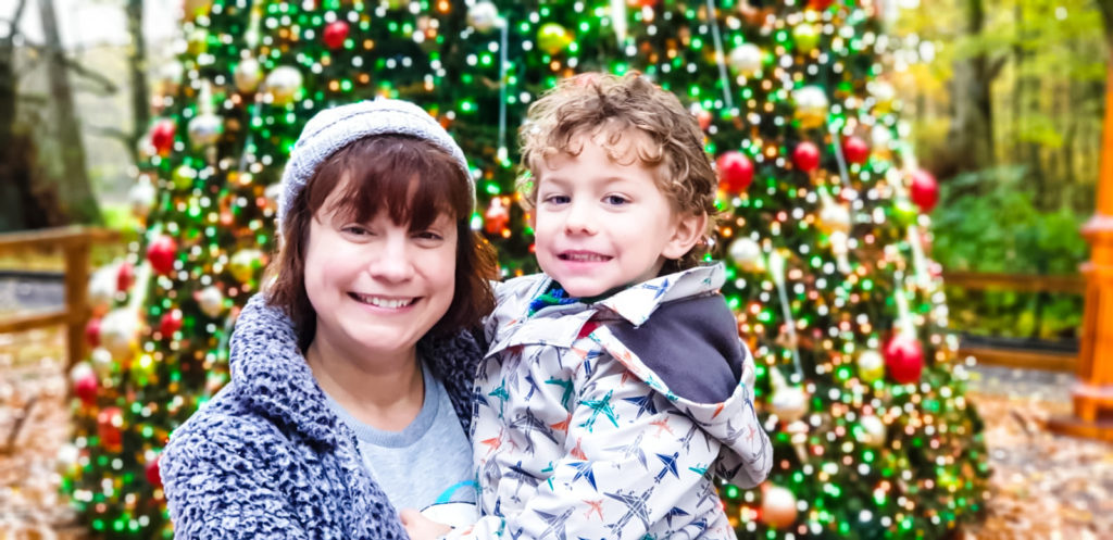 Mum and son by the Christmas tree at Longleat