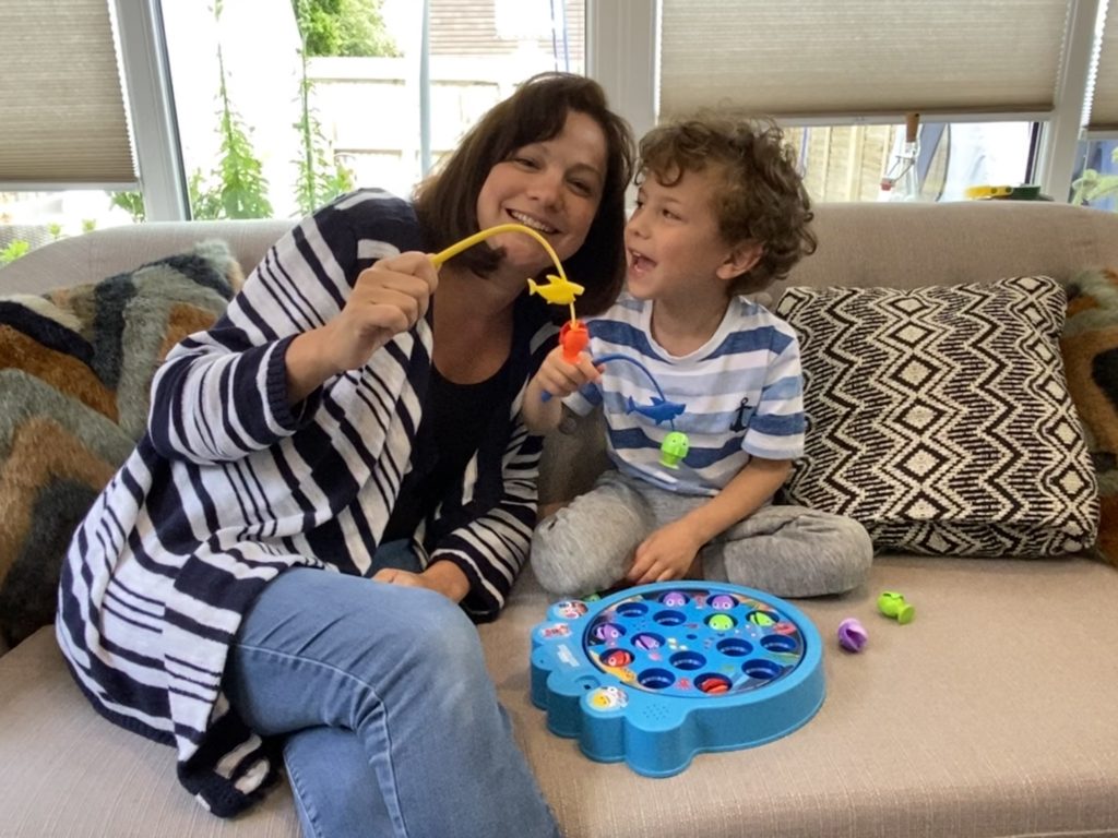 Mum and son playing PinkFong baby shark let's go hunt fishing game