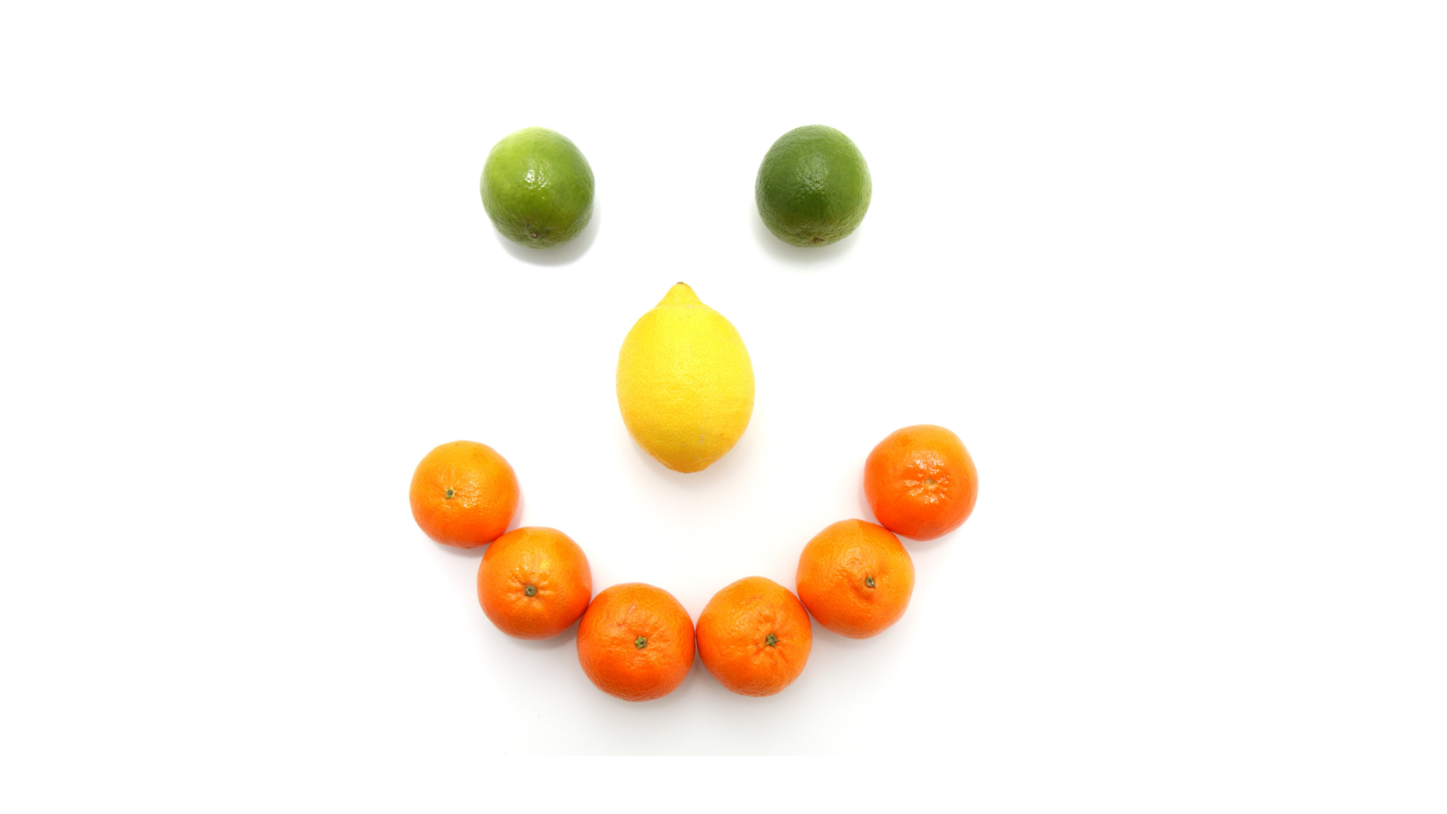 Smily fruit face with lemon lime and oranges