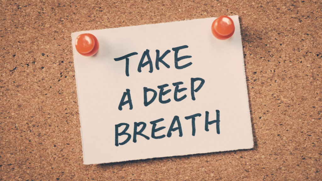 Sign pinnd on notice board saying Take a Deep Breath