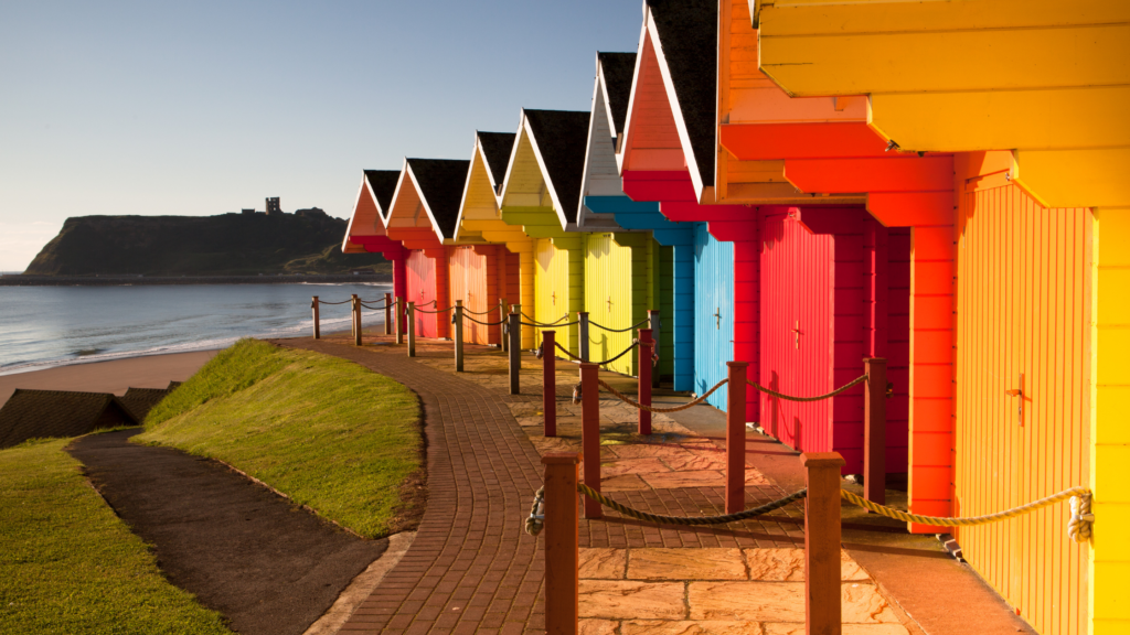 Row of brightly coloured beach huts in England