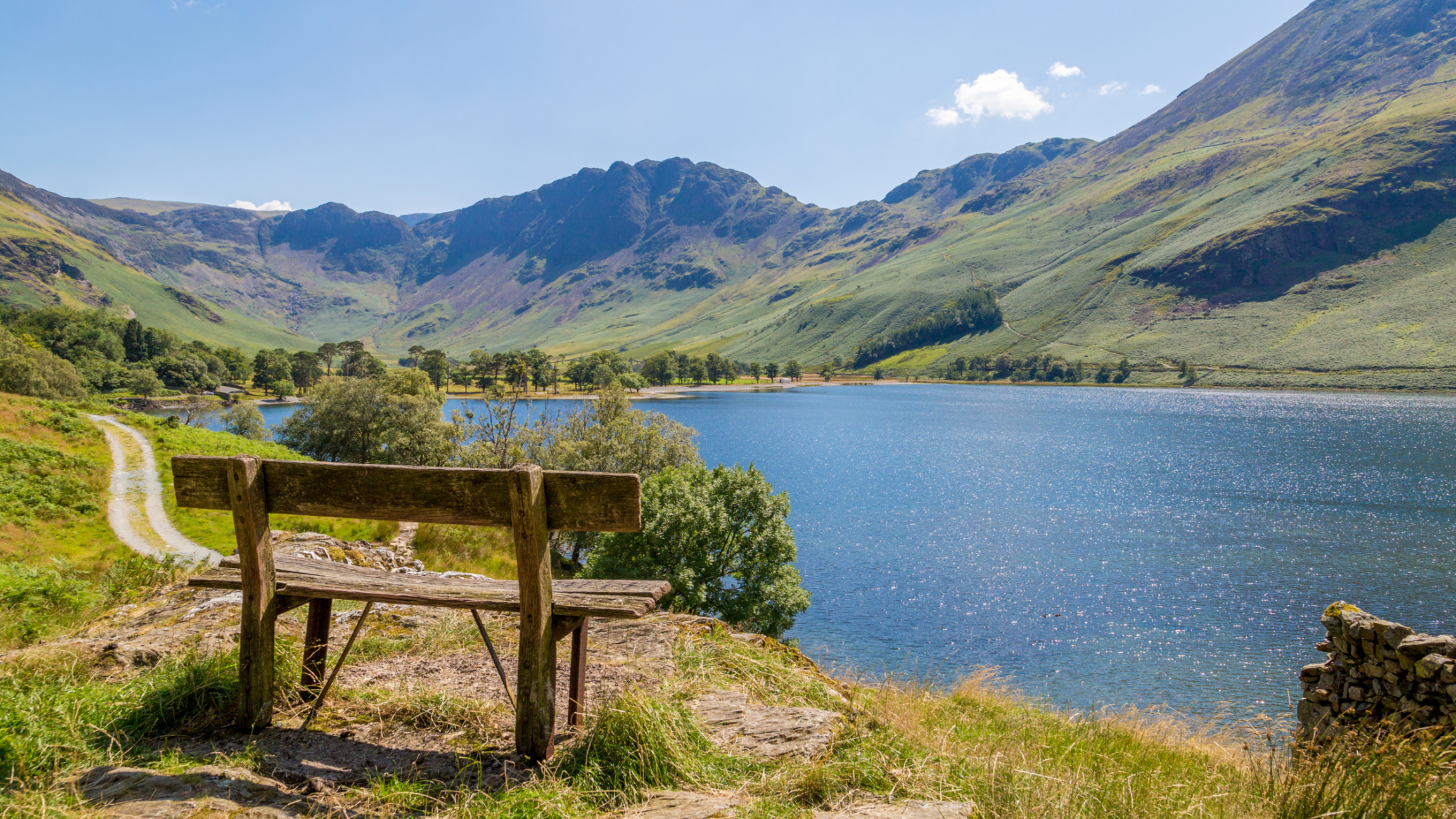 Lake district with bench and view to the lake
