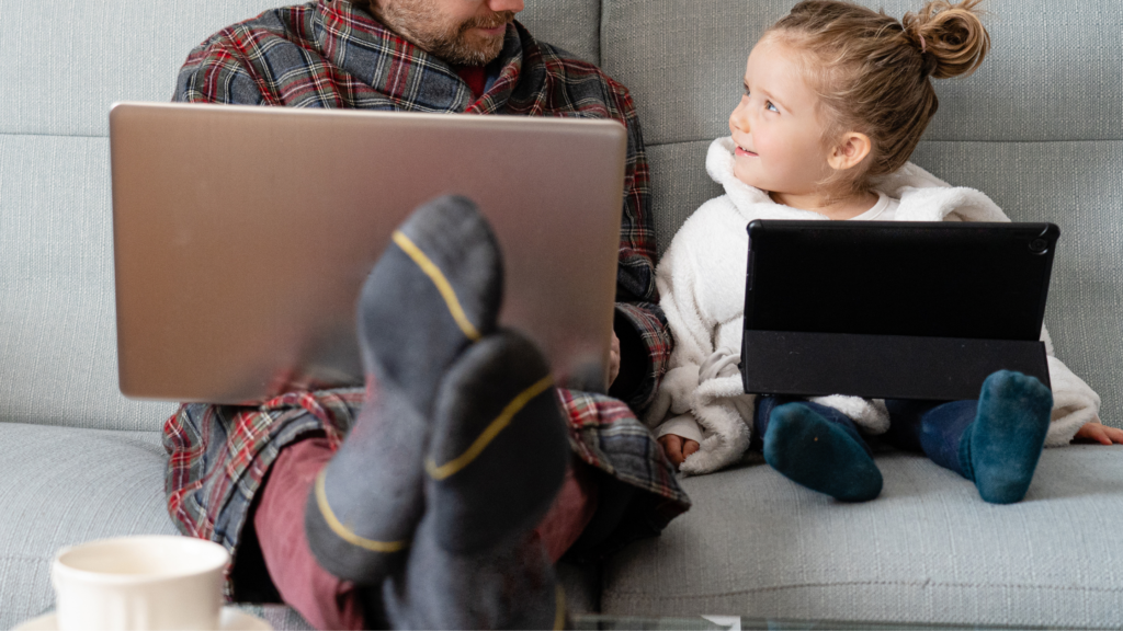dad working from home with his daughter