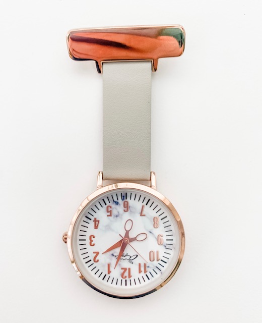 Nurses watch with scissors to tell the time