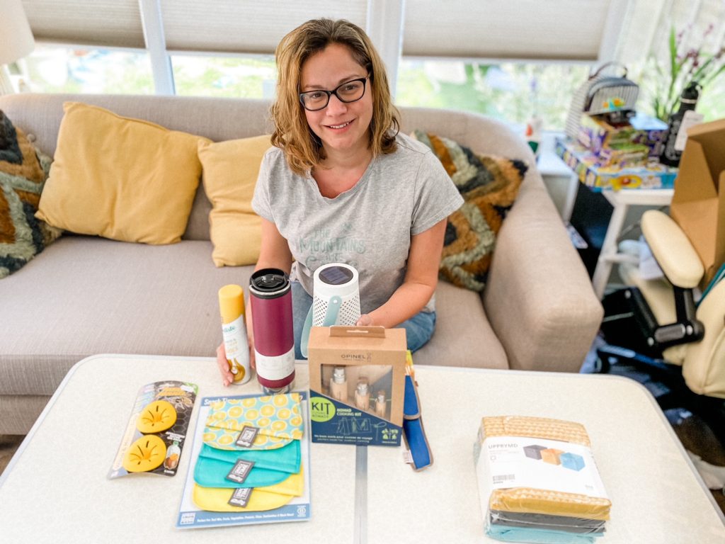 Lady showing some of her top camping essentials