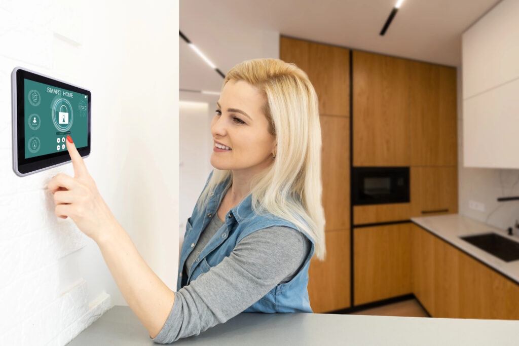 Lady using smart technology in her home