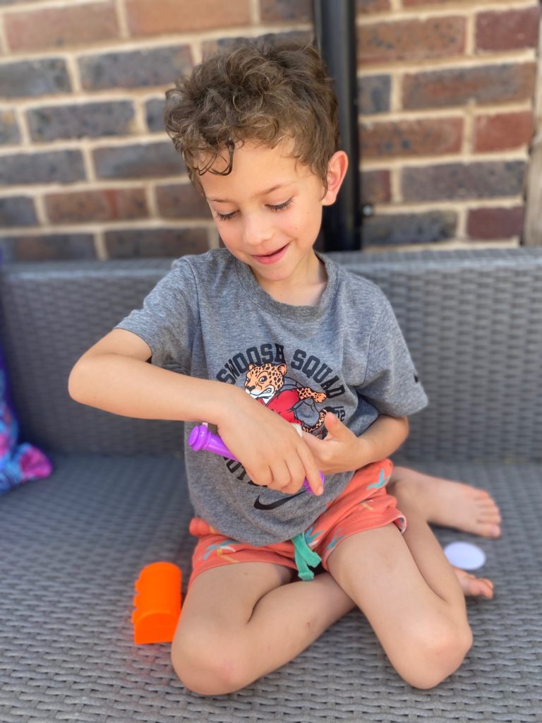 Boy playing with treasure map free gift from issue 1 of Hey Duggee