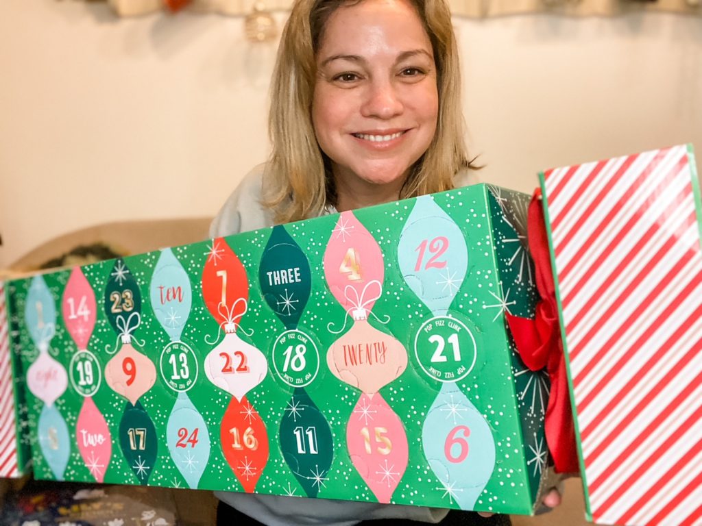 Picture of lady with her Hampers of Distinction fizz advent calendar