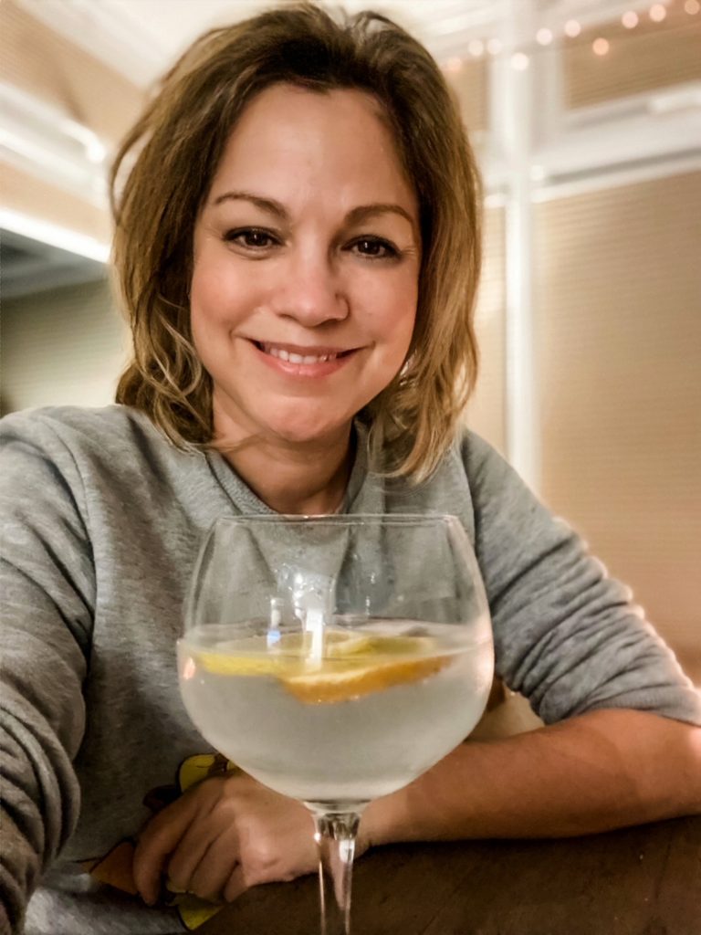 woman with a big glass of st clements gin