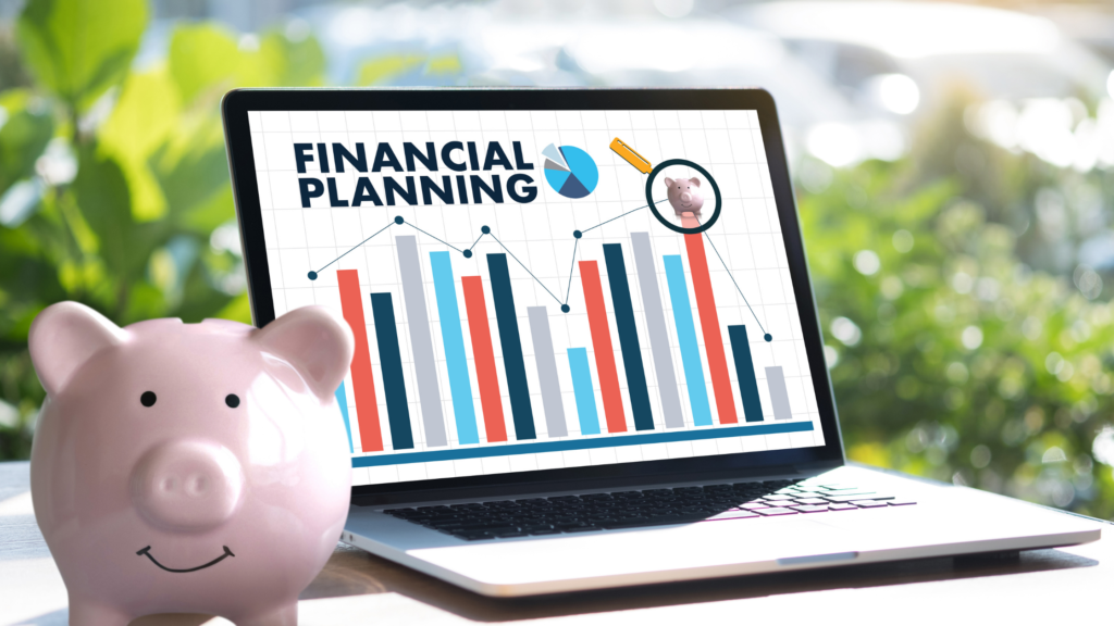Laptop with presentation saying Financial Planning with piggy bank next to it.