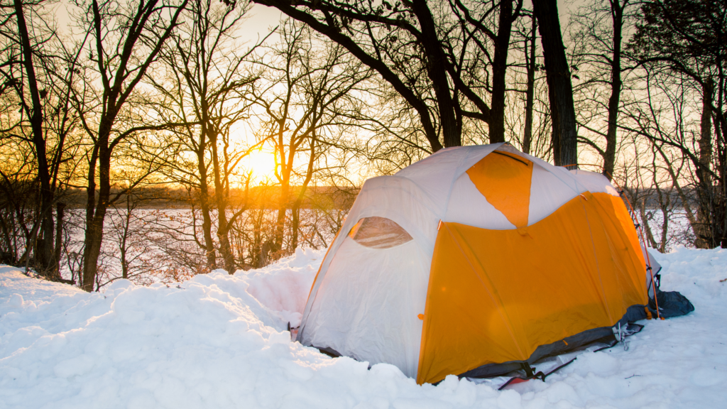 Winter camping with tent in the snow