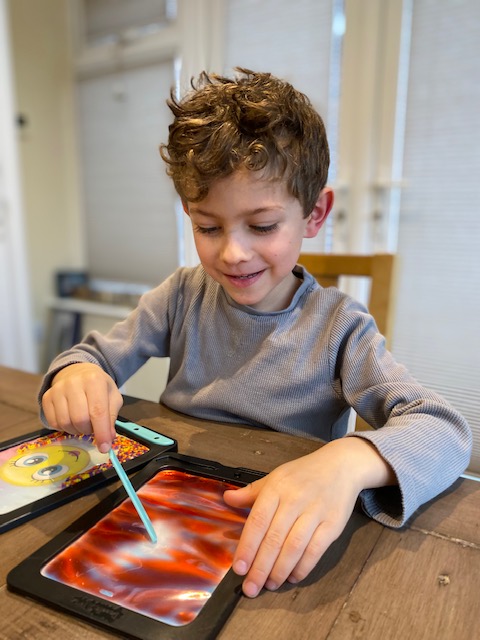 Boy playing with his DoodleJamz