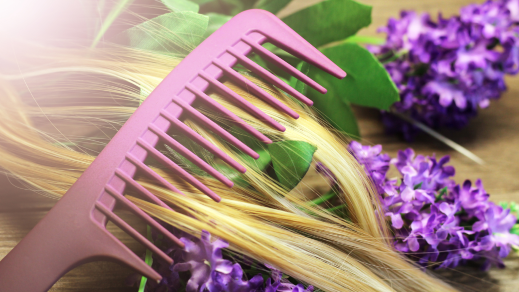 pink comb on blonde hair with purple flowers