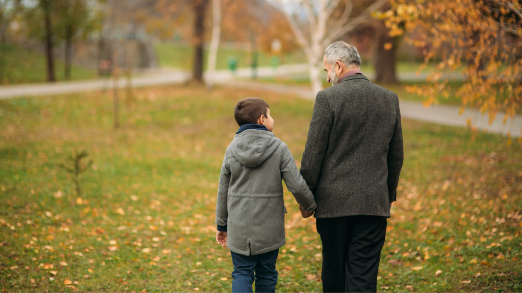 Grandad and Grandson walking in the countryside