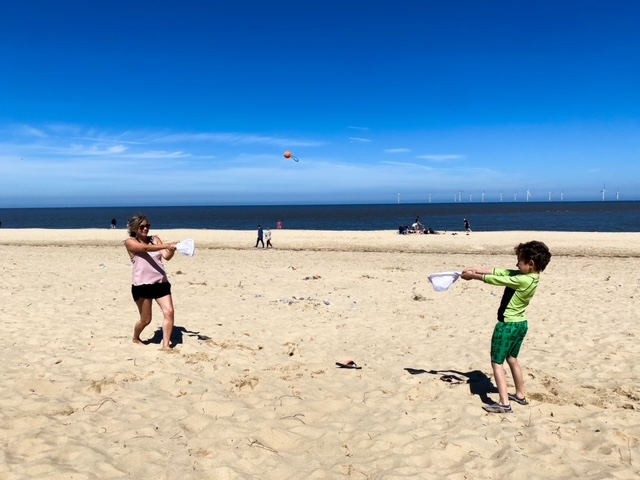 Mum and son playing sling ball