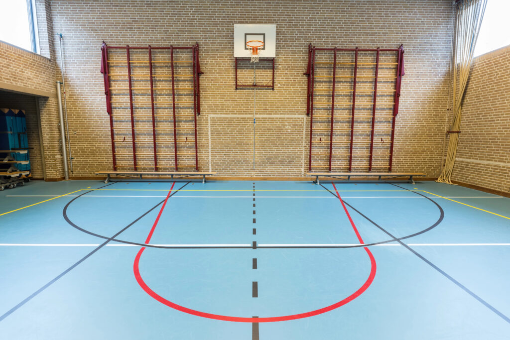School sports hall with basketball net
