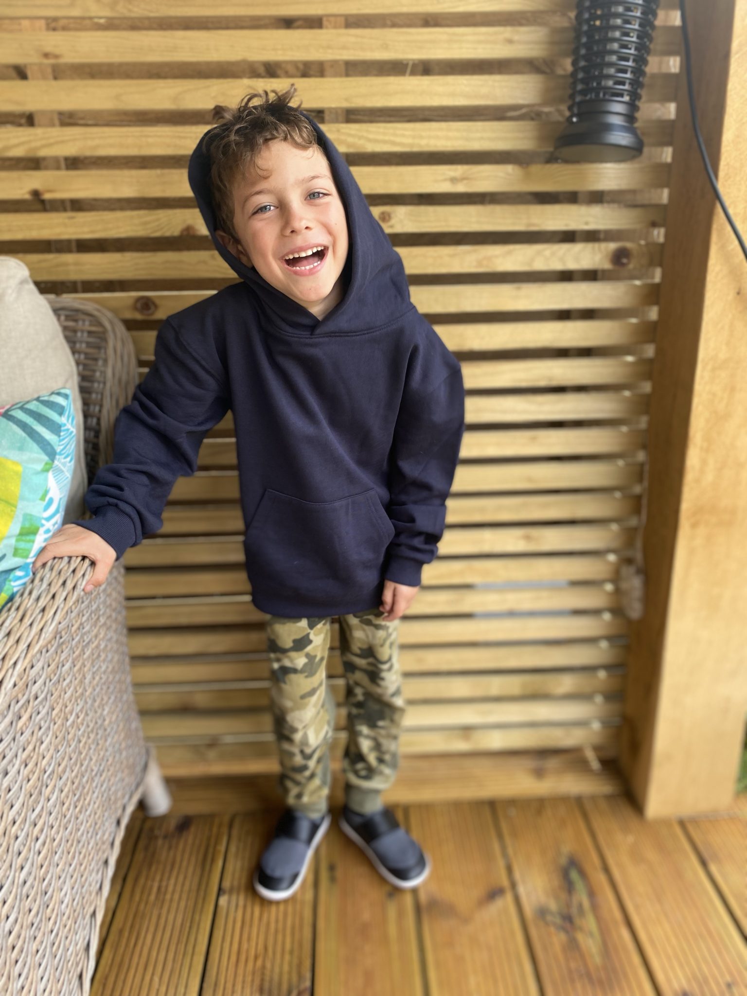 Boy laughing in David Luke eco pe hoodie