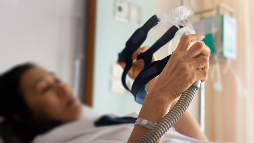 Woman using a CPAP machine