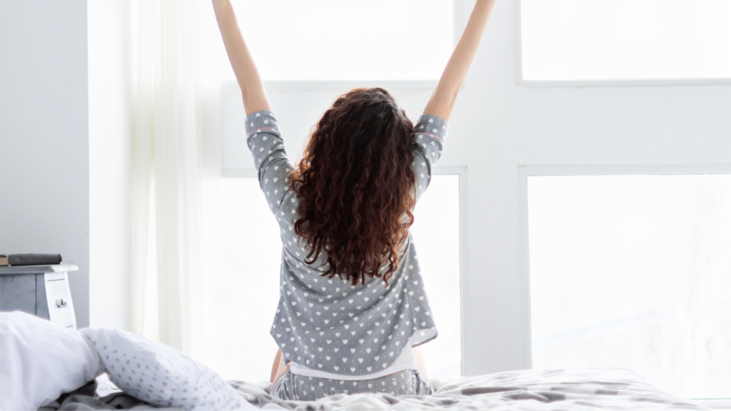 Lady waking up and stretching