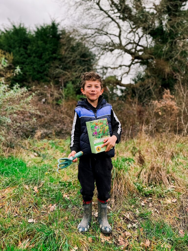 Boy with a pack of wildflower seeds