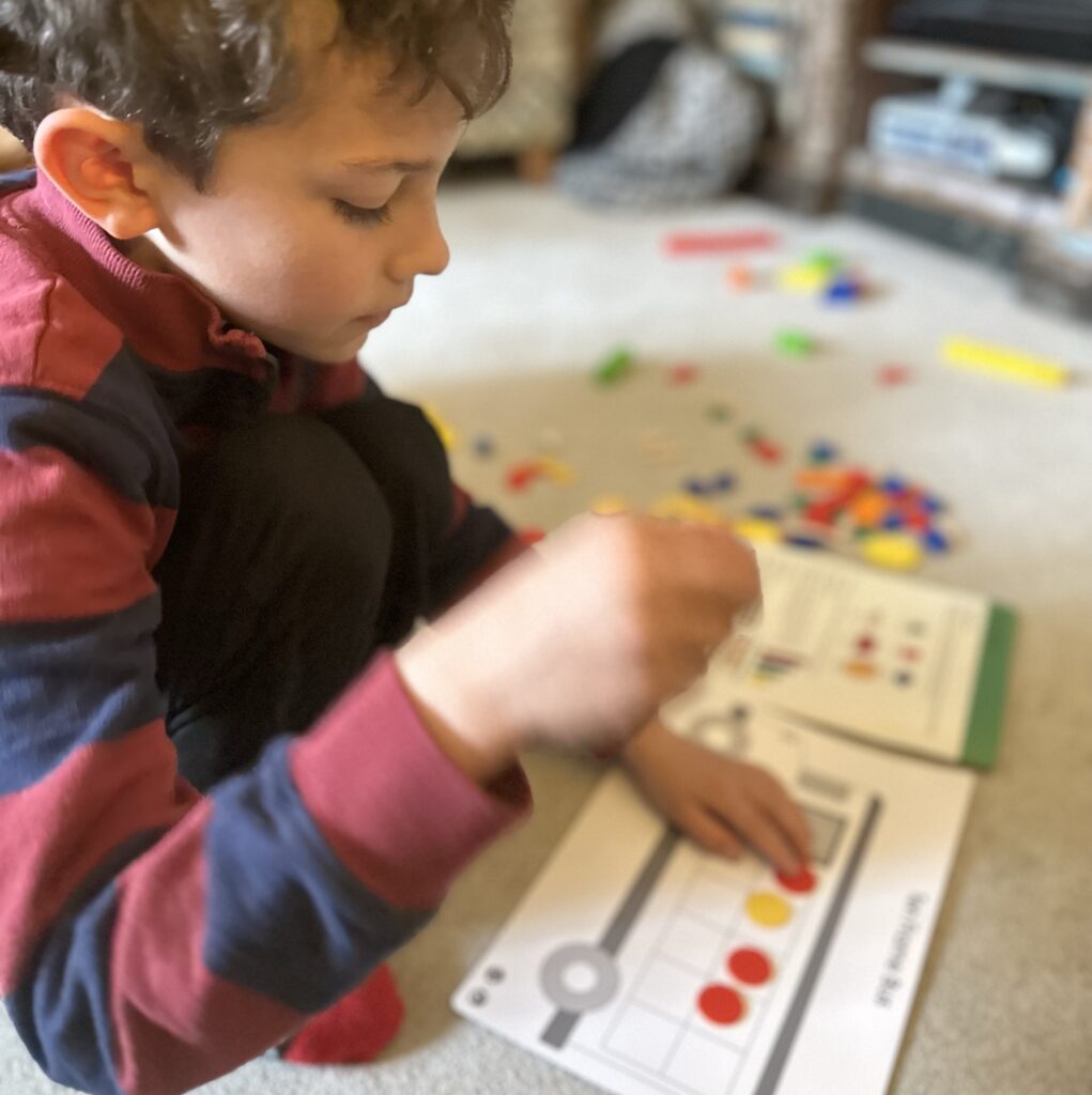 Boy playing with his EdEx Education Maths set