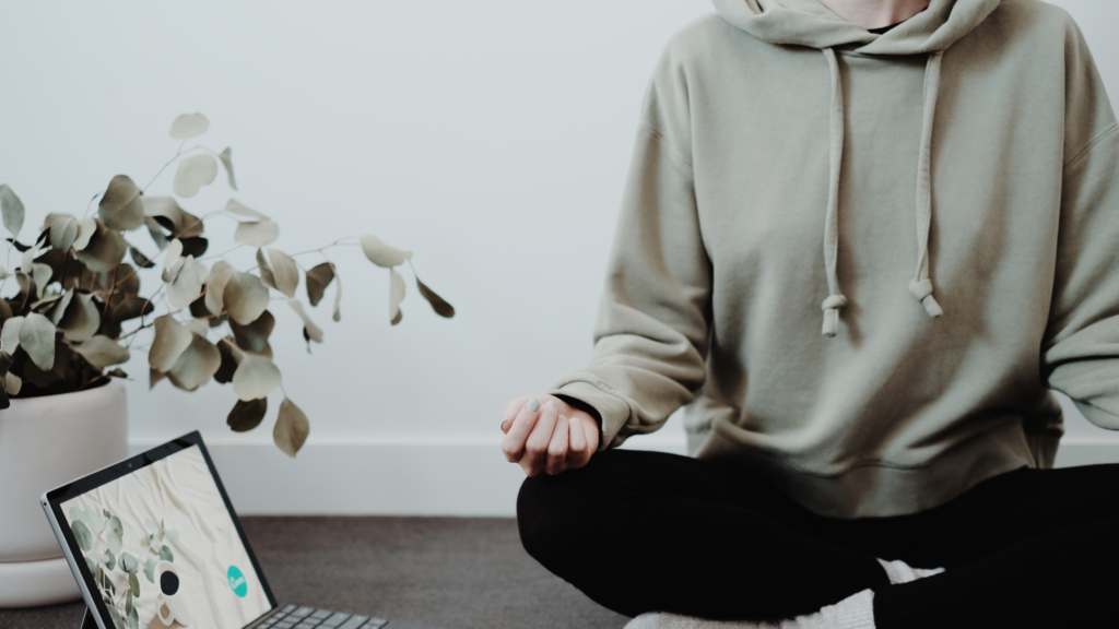 Part of person meditating