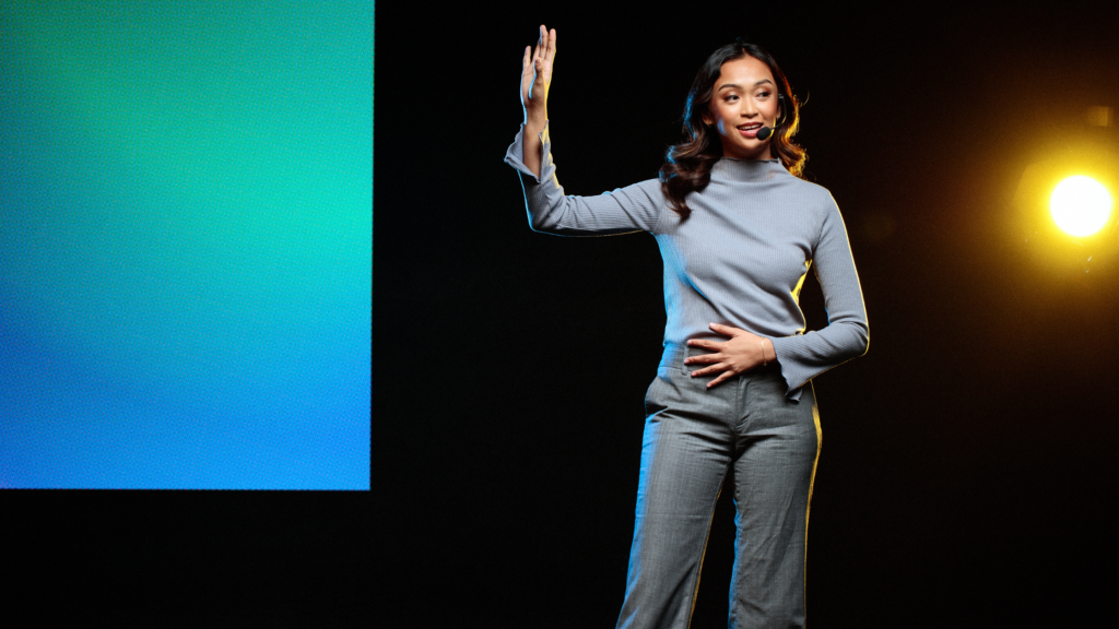 Woman on stage giving a public speech