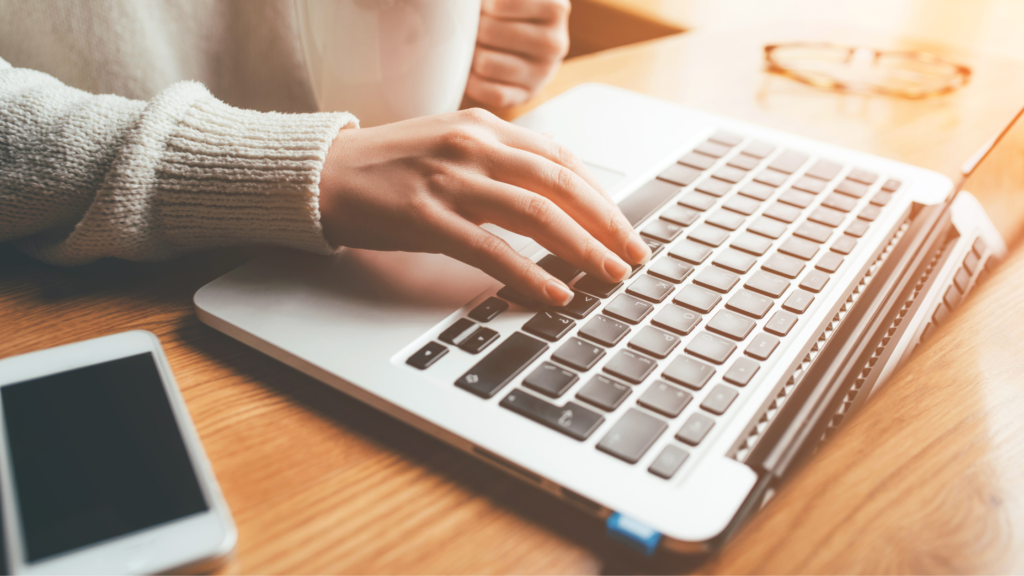Woman's hand on laptop