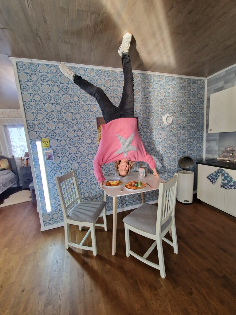 Lady at the Upside Down House in Brighton