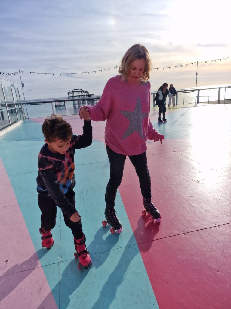 Mum and son skating at the i360