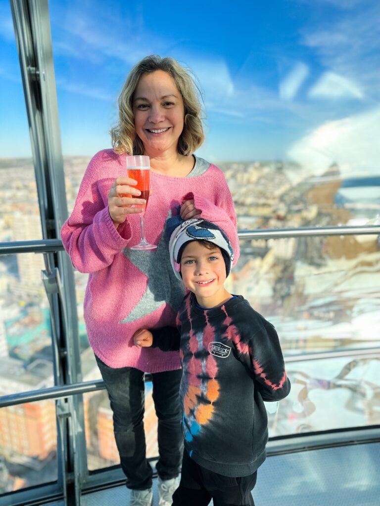 Mum with a glass of Nytimber from the SkyBar on the i360 with son