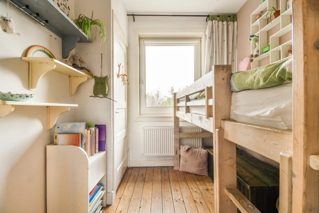 A small bedroom with a bunk bed to maximise space