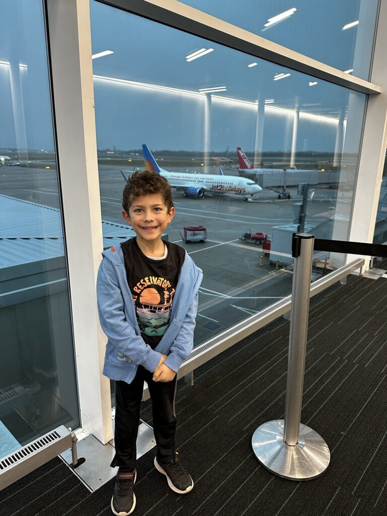 Boy at London Stansted Airport ready to get on our Jet2 plane to paphos in Cyprus