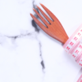 Fork wrapped in a tape measure