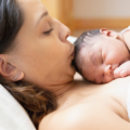 New mum in hospital with her newborn baby