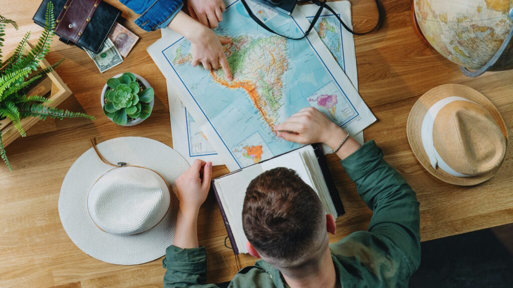 Heads of dad and son planning a family road trip looking at a map