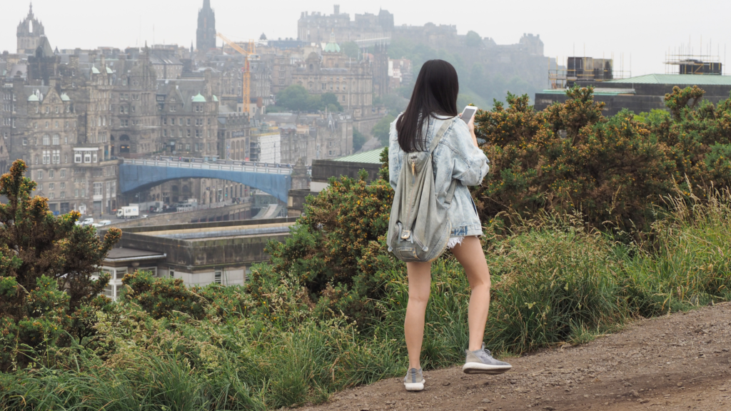 Girl walking up Calton Hill in Edinburgh