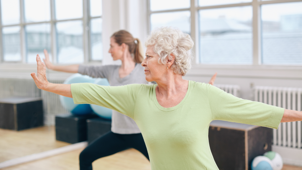 Two ladies doing yoga to improve their balance and health