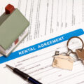 rental agreement with small toy house model
