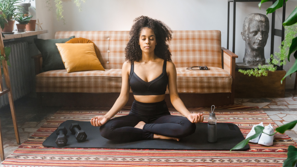 Woman mediating in her living room