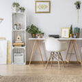 Home office in light colours with white walls, chair and hammock