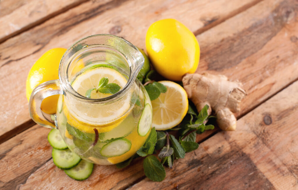 Jug of water with lemon, mint, ginger and cucumber