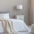 King size bed in neutral coloured bedroom