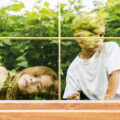 Two children looking out of a double Glazing Sash Windows with partitions in mirrored double-glazed Windows