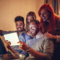 Group of friends entertaining themselves at home