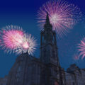 Celebratory fireworks for new year over he Hub from the Royal Mile, previously Church of Scotland Highland Tolbooth St John's Church in Edinburgh during New Years Celebrations