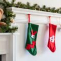 Stockings hanging up waiitng for santa on the fireplace with teddy