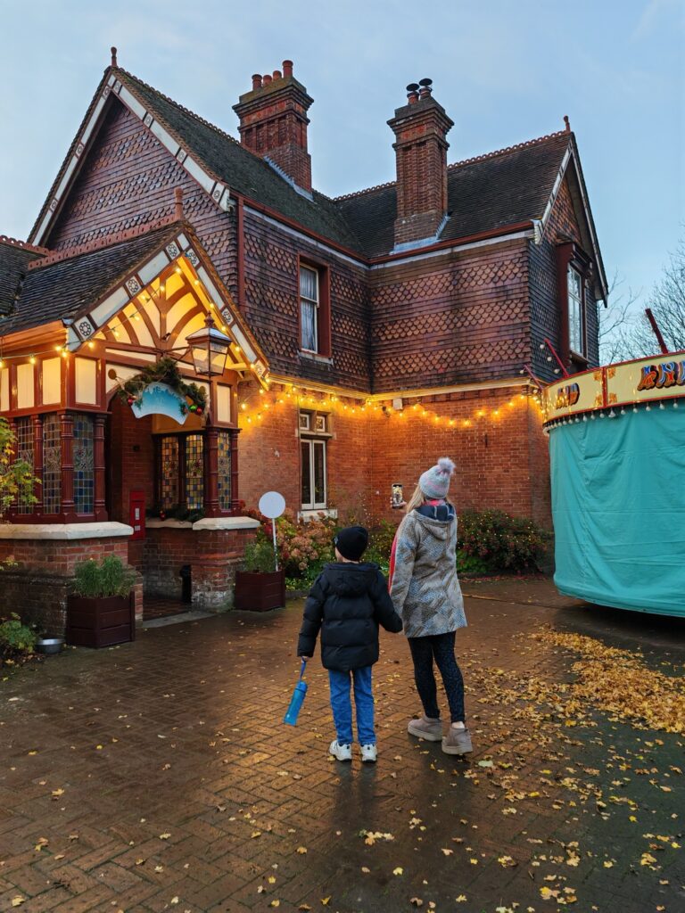 Mum and son admiring the Christmas decoration at Bluebell Railway Sheffield Park